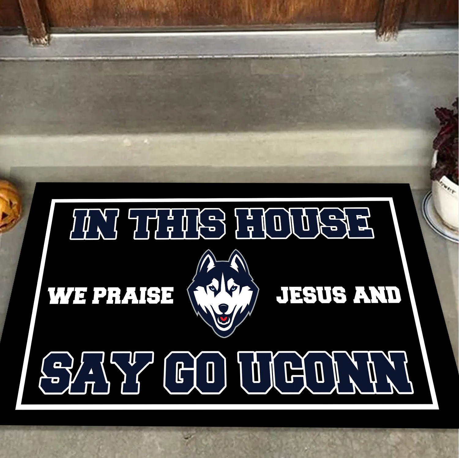 In This House We Praise Jesus And Say Go Uconn Doormat Uconn Huskies Fan Merchandise